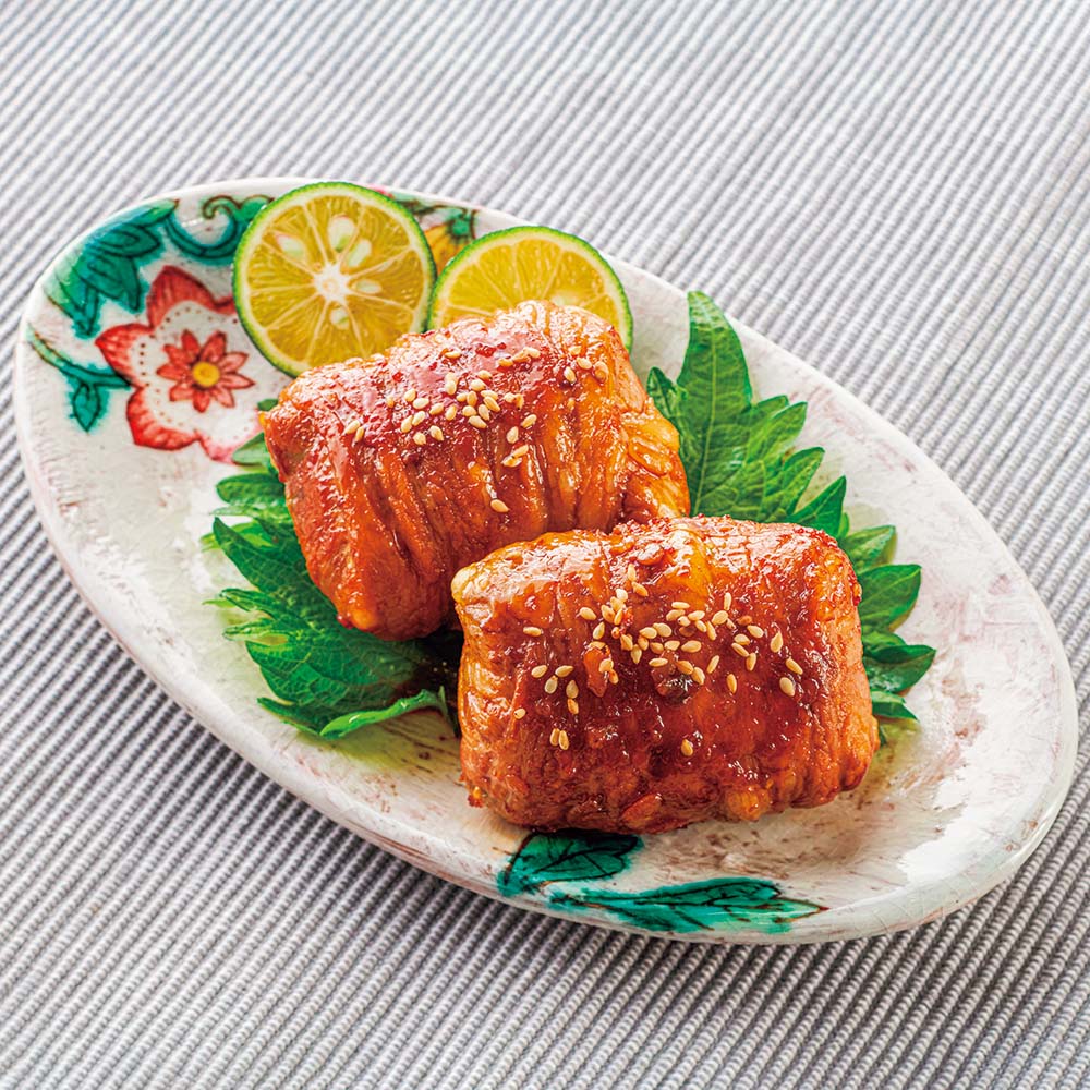 Rice ball wrapped in honey glazed pork with shiso